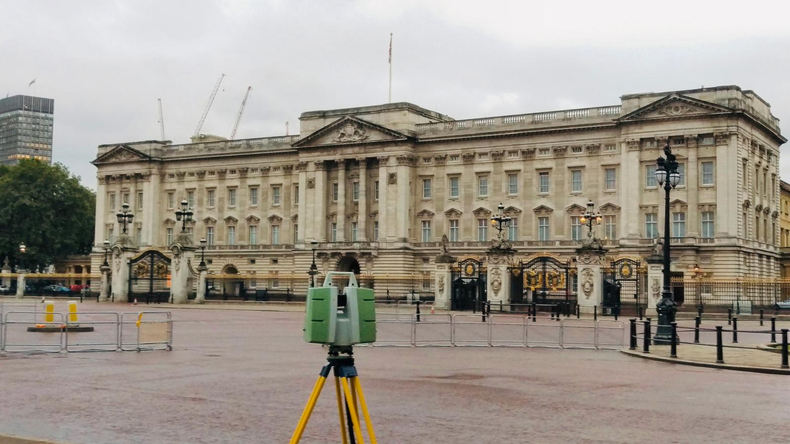 Laser scanner on a yellow tripod in front of Buckingham Palace